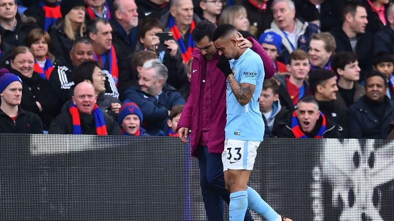 Manchester City striker Gabriel Jesus is consoled after picking up an injury against Crystal Palace