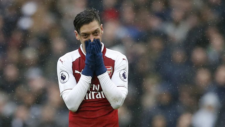 Mesut Ozil reacts during the Premier League match between Tottenham Hotspur and Arsenal at Wembley Stadium