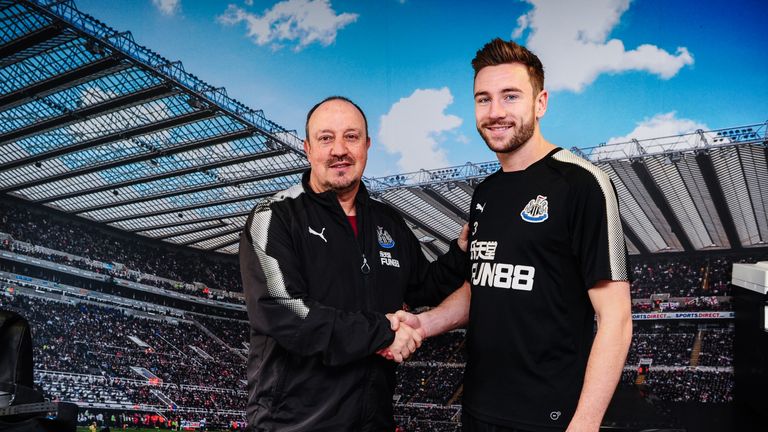 Paul Dummett poses with Newcastle United manager Rafael Benitez after signing a contract extension