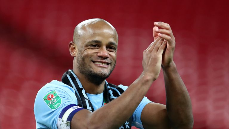 Vincent Kompany celebrates on the pitch after winning 3-0 against Arsenal in the Carabao Cup Final