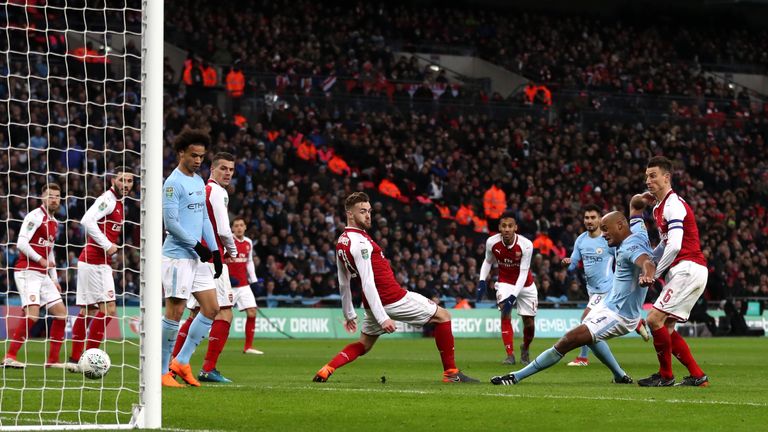 Vincent Kompany scores Manchester City's second goal during the Carabao Cup Final against Arsenal