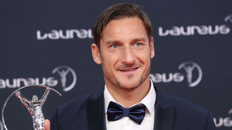 Former Italian football player and AS Roma forward Francesco Totti poses with his Laureus academy exceptional achievement award