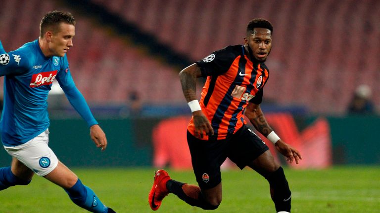 Napoli's midfielder from Poland Piotr Zielinski (L) vies with Shakhtar Donetsk's Brazilian midfielder Fred during the UEFA Champions League Group F footbal