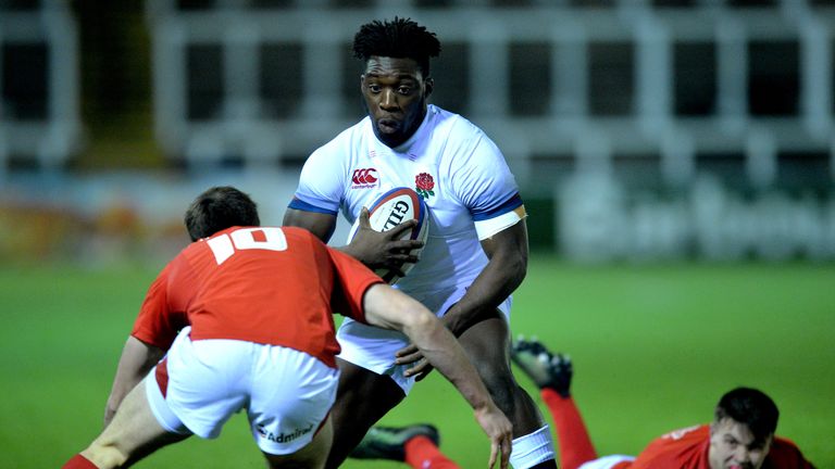 NEWCASTLE UPON TYNE, ENGLAND - FEBRUARY 09: Gabriel Ibitoye of England is tackled by Cai Evans of Wales during the RBS Under 20's Six Nations match between