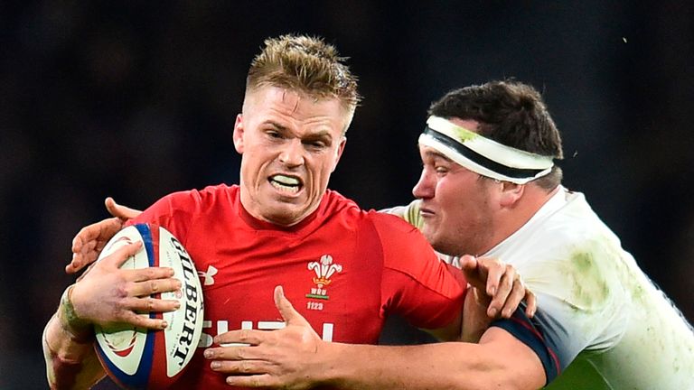 Gareth Anscombe is tackled by Jamie George at Twickenham Stadium in Round 2 of the Six Nations