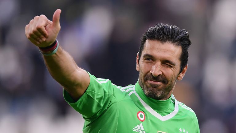 TOPSHOT - Juventus' goalkeeper Gianluigi Buffon celebrates at the end of the Italian Serie A football match between Juventus and Sassuolo on February 4, 20