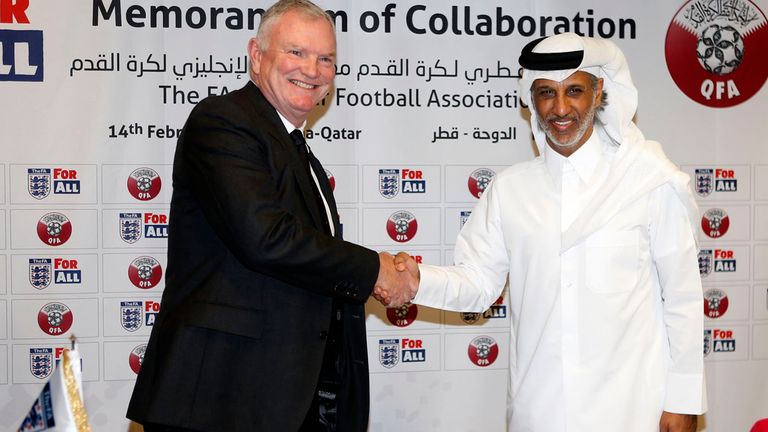 A picture taken on February 14, 2018, shows Sheikh Hamad Bin Khalifa Bin Ahmed Al-Thani (R), President of the Qatar Football Association, posing for a pict