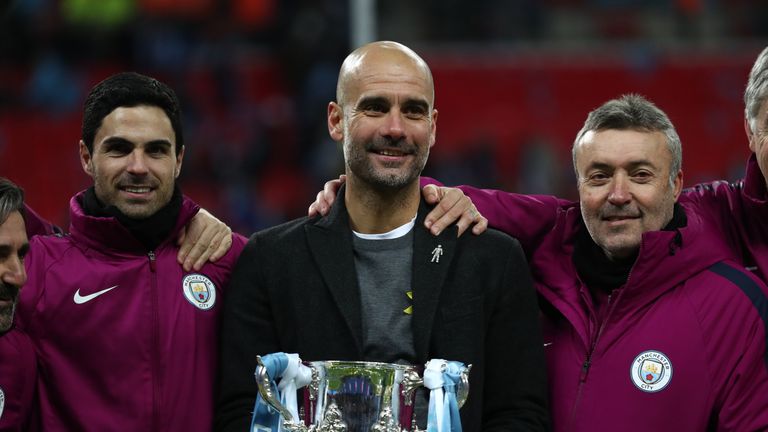 Pep Guardiola celebrates with his Man City assistants after winning the Carabao Cup