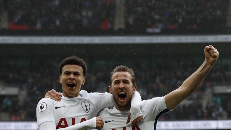Tottenham Hotspur's English striker Harry Kane (R) celebrates scoring the opening goal with Tottenham Hotspur's English midfielder Dele Alli (L) during the