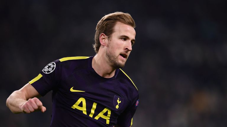 Tottenham Hotspur's English striker Harry Kane celebrates scoring his team's first goal during the UEFA Champions League round of sixteen first leg footbal