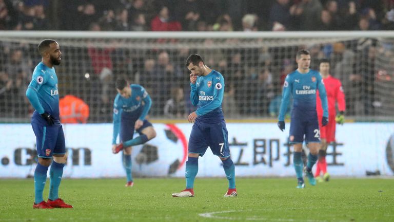 Arsenal's Henrikh Mkhitaryan (centre) looks dejected after Arsenal concede their third goal of the game during the Premier League match at the Liberty Stad