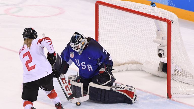 Madeline Rooney #35 of the United States makes a save against Meghan Agosta #2 of Canada