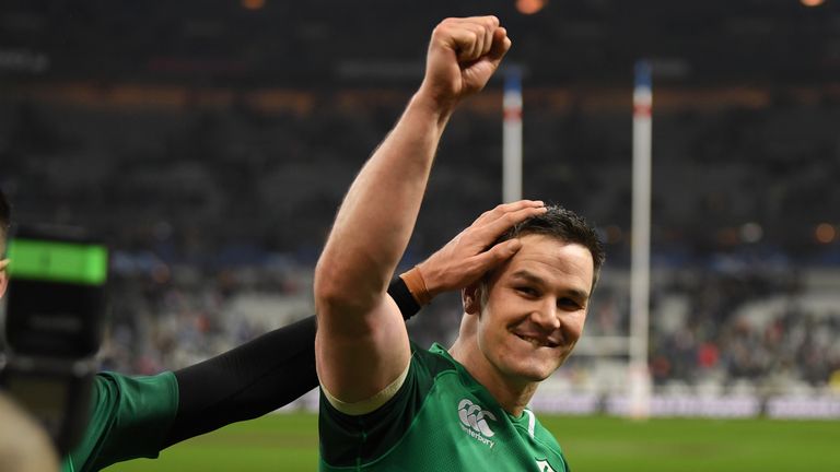Jonathan Sexton of Ireland salutes the Irish fans after dropping a long range goal to win the match for Ireland in the Stade de France