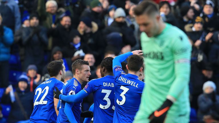 Leicester players celebrates as Stoke goalkeeper Jack Butland reacts after deflecting Marc Albrighton's cross into his own net