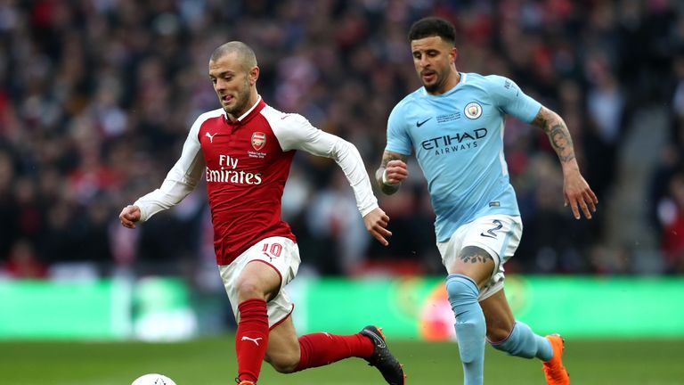 Jack Wilshere and Kyle Walker in action during the Carabao Cup Final between Arsenal and Manchester City