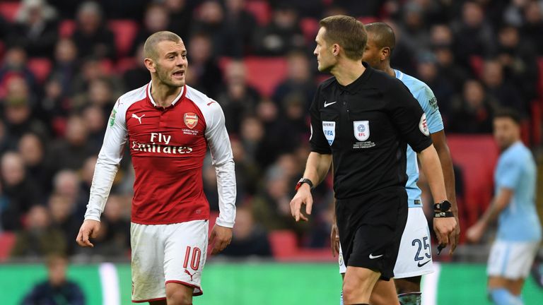 LONDON, ENGLAND - FEBRUARY 25:  Arsenal's Jack Wilshere complains to referee