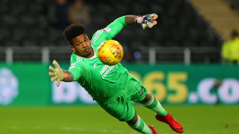 HULL, ENGLAND - FEBRUARY 23: Jamal Blackman of Sheffield United dives towards the far post during the Sky Bet Championship match between Hull City and Shef
