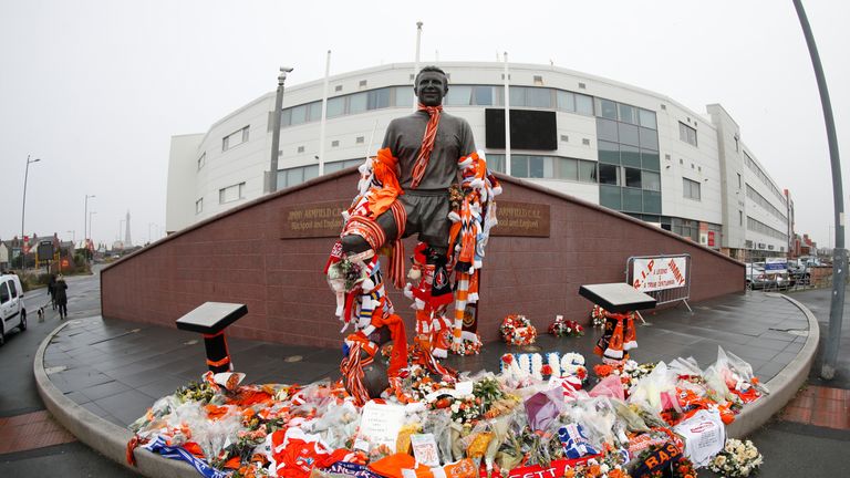 Tributes are left at the Jimmy Armfield statue ahead of his funeral cortege passing through Bloomfield Road in Blackpool