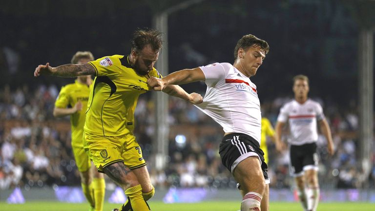LONDON, ENGLAND - SEPTEMBER 13:  John Brayford of Burton Albion tries to tackle Chris Martin of Fulham during the Sky Bet Championship match between Fulham