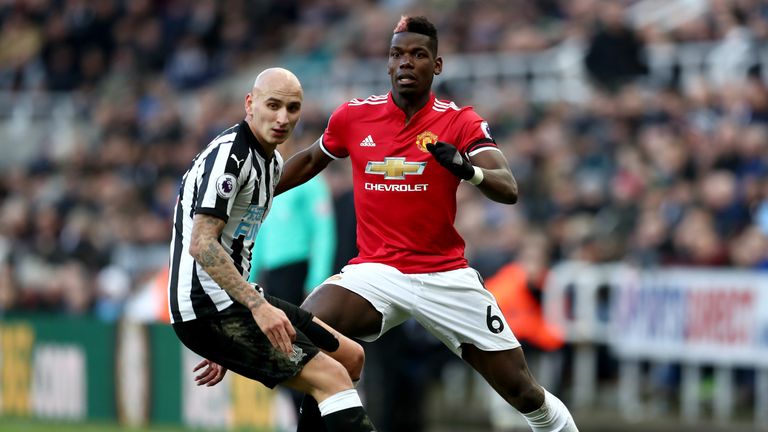 Paul Pogba of Manchester United is challenged by Jonjo Shelvey of Newcastle United during the Premier League match