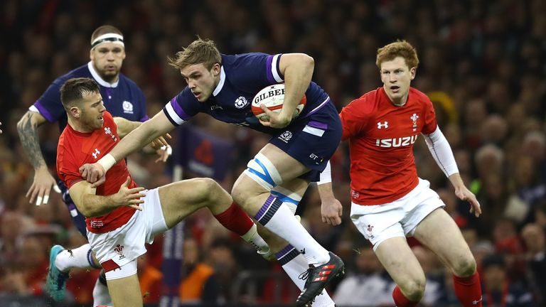 Jonny Gray looks to get past Gareth Davies.