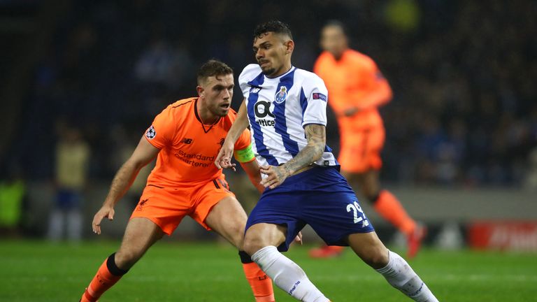 PORTO, PORTUGAL - FEBRUARY 14:  Soares of FC Porto holds off Jordan Henderson of Liverpool during the UEFA Champions League Round of 16 First Leg match bet