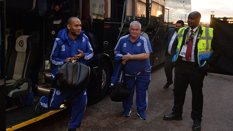 Chelsea's assistant first-team coach Jose Morais (L) exits the team bus as he arrives ahead of the English Premier League football match between Stoke City