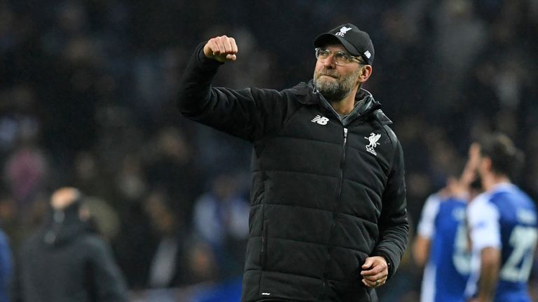 Liverpool's German manager Jurgen Klopp celebrates their victory on the pitch after the UEFA Champions League round of sixteen first leg football match bet