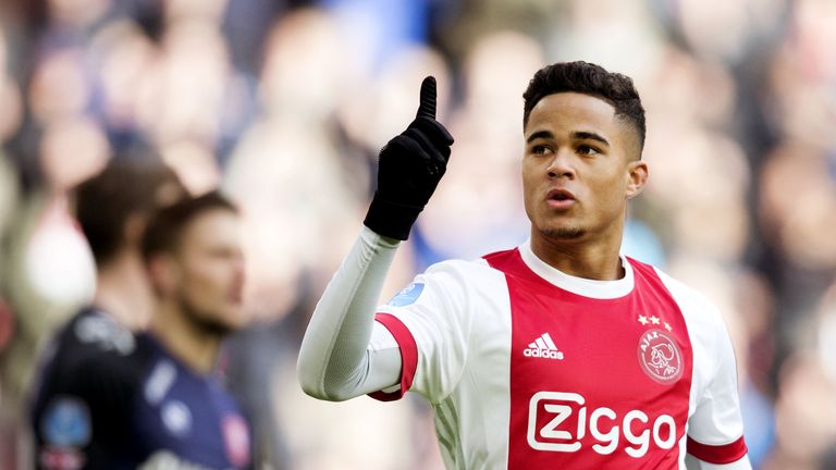 Ajax Amsterdam's midfielder Justin Kluivert reacts after opening the scoring during the Dutch Eredivisie soccer match between Ajax Amsterdam and FC Twente 