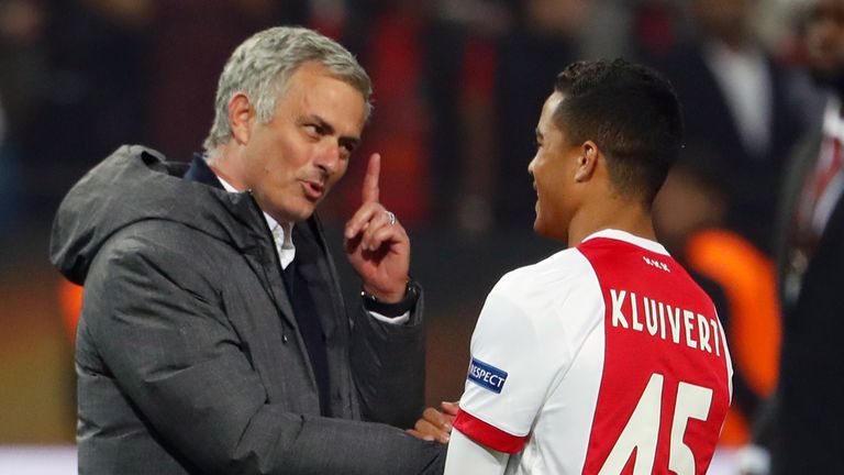 Manchester United's Portuguese manager Jose Mourinho (L) spaeks with Ajax Dutch forward Justin Kluivert after the UEFA Europa League final football match A