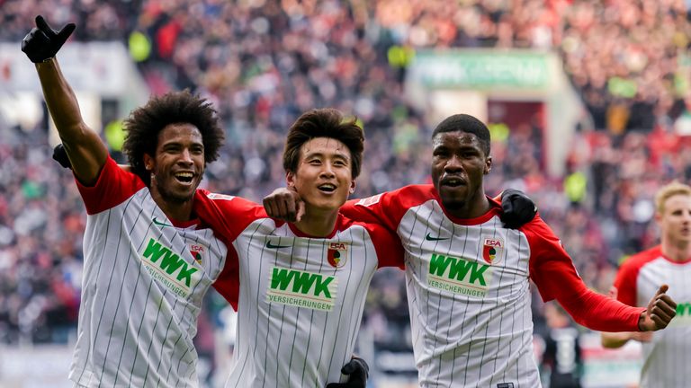 Kevin Danso (right) is popular with his Augsburg team-mates