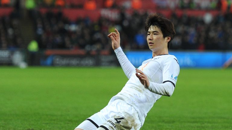 SWANSEA, WALES - FEBRUARY 10:  Ki Sung-Yueng of Swansea City celebrates after scoring his sides first goal during the Premier League match between Swansea 