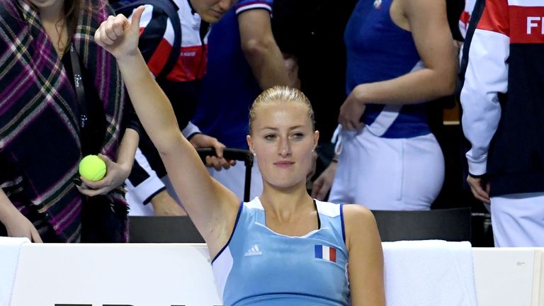 France's Kristina Mladenovic gestures after winning the  double tennis match against Belgium's Kirsten Flipkens (R) and Belgium's Elise Mertens