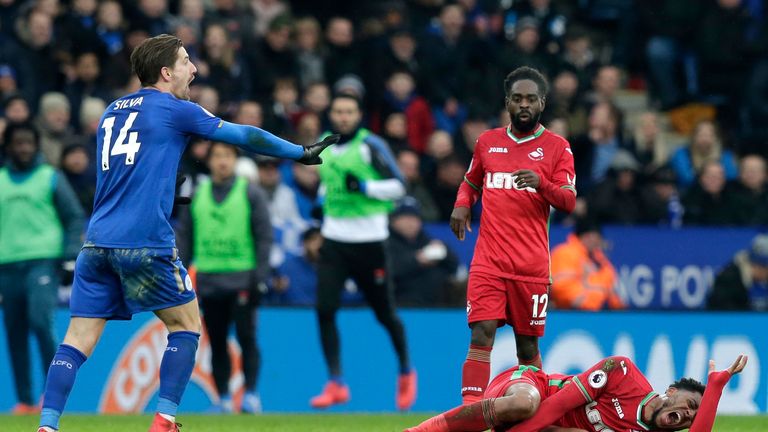 LEICESTER, ENGLAND - FEBRUARY 03:  Leroy Fer of Swansea City goes down injured during the Premier League match between Leicester City and Swansea City at T