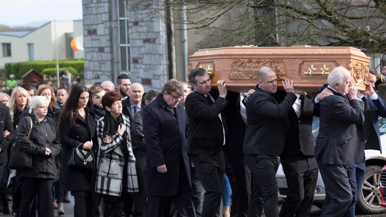Mourners attend the funeral of former Celtic and Manchester United footballer, Liam Miller