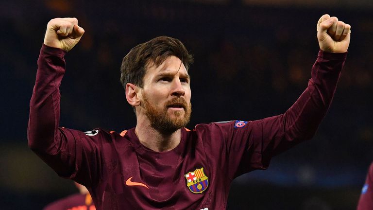 Barcelona's Argentinian striker Lionel Messi celebrates after scoring their first goal during the first leg of the UEFA Champions League round of 16 footba