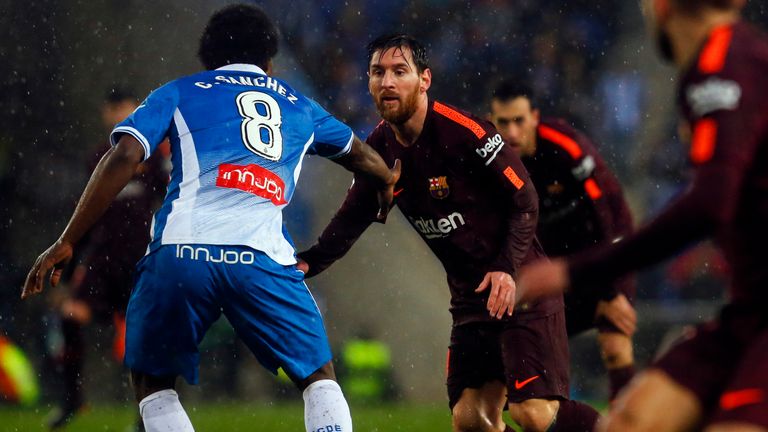 Barcelona's Argentinian forward Lionel Messi vies with Espanyol's Colombian midfielder Carlos Sanchez during the Spanish league football match between RCD 