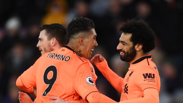 SOUTHAMPTON, ENGLAND - FEBRUARY 11: Mohamed Salah of Liverpool celebrates after scoring his sides second goal with Roberto Firmino of Liverpool during the 