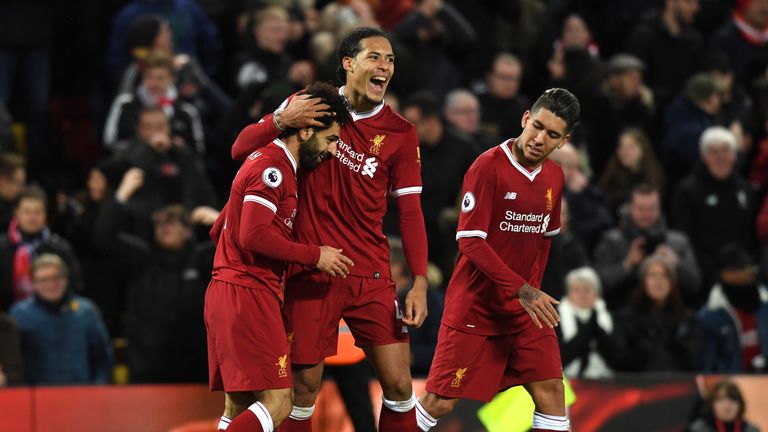 Mohamed Salah is mobbed by Virgil van Dijk after his sublime second strike