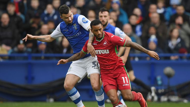 SHEFFIELD, ENGLAND - FEBRUARY 17:  Luciano Narsingh of Swansea City and Daniel Pudil of Sheffield Wednesday in action during the The Emirates FA Cup Fifth 