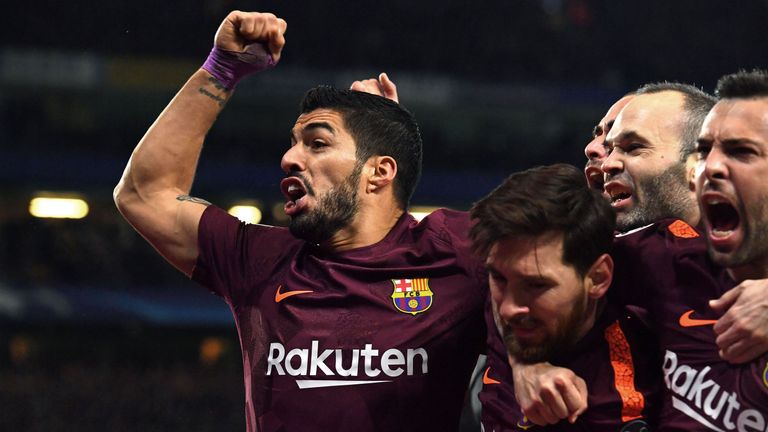 Barcelona's Argentinian striker Lionel Messi (C) celebrates with Barcelona's Uruguayan striker Luis Suarez (L) and teammates after scoring their first goal