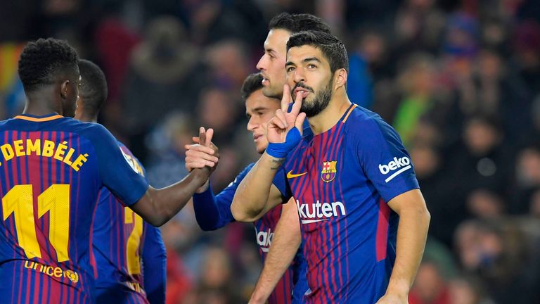 Barcelona's Uruguayan forward Luis Suarez (R) celebrates after scoring during the Spanish league football match between FC Barcelona and Girona FC at the C