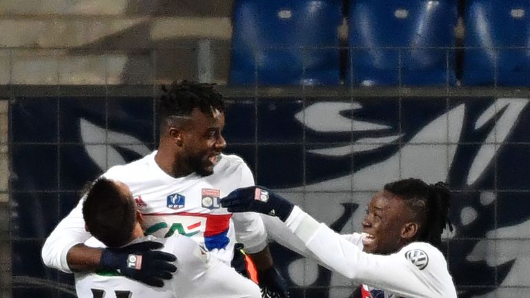 Lyon's French forward Maxwel Cornet (2ndL) celebrates with his teammates after scoring a goal during the French Cup football match between Montpellier and 