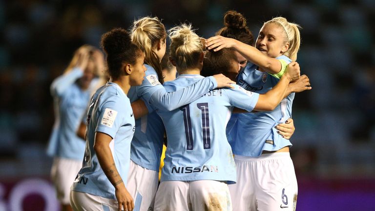 MANCHESTER, ENGLAND - NOVEMBER 16:  Izzy Christiansen of Manchester City Women is mobbed by team mates after scoring her goal during the UEFA Women's Champ