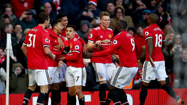 MANCHESTER, ENGLAND - FEBRUARY 25:  Jesse Lingard of Manchester United celebrates after scoring his sides second goal with team mates during the Premier Le