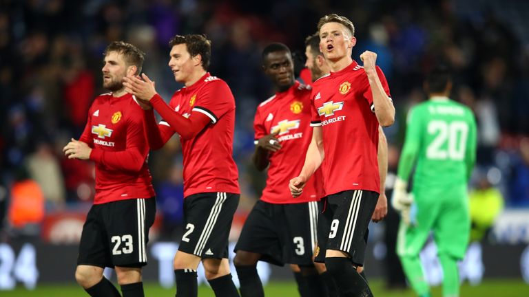 Manchester United players applaud fans after the win at Huddersfield