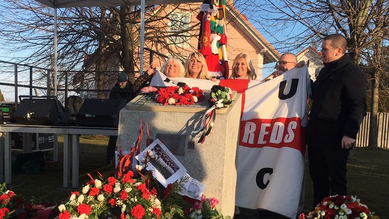 Manchester United supporters unveil a plaque upon the site of the Munich Air Disaster on the 60th anniversary