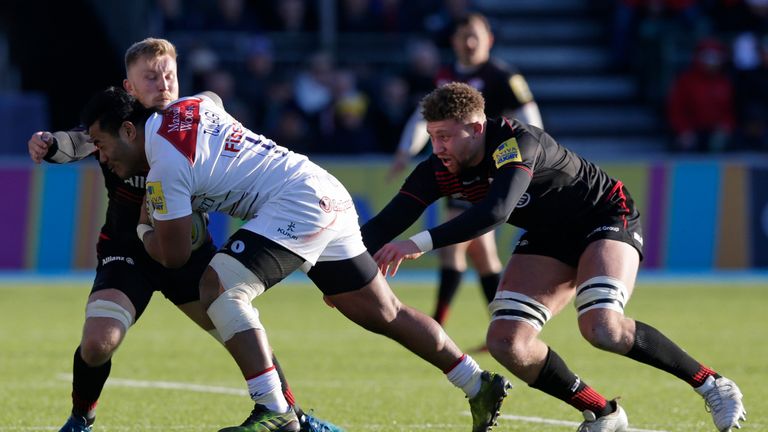  Manu Tuilagi of Leicester Tigers tackled by Jackson Wray (l) and Nick Isiekwe of Saracens