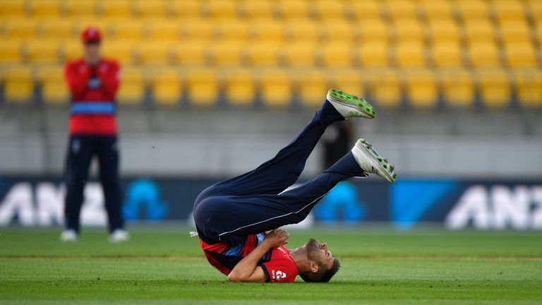 WELLINGTON, NEW ZEALAND - FEBRUARY 13:  England bowler Mark Wood reacts after missing a run out chance to dismiss Kane Williamson during the International 