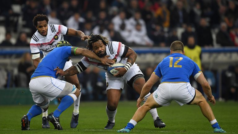 MARSEILLE, FRANCE - FEBRUARY 23:  Mathieu Bastareaud of France is tackled by Maxime Mbanda and Tommaso Castello of Italy during the NatWest Six Nations mat
